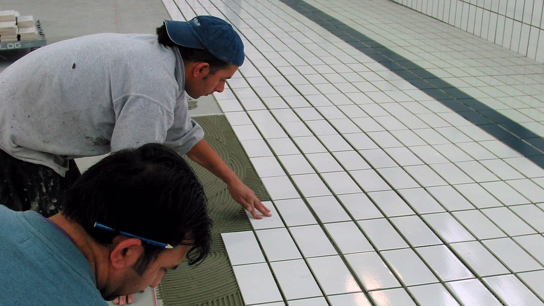 Laying of the new tiles in the swimming pool