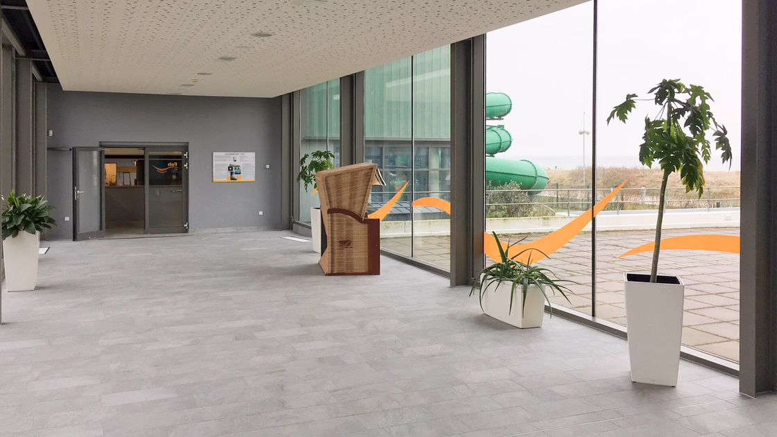 Beach chairs for relaxation on grey tiled floor