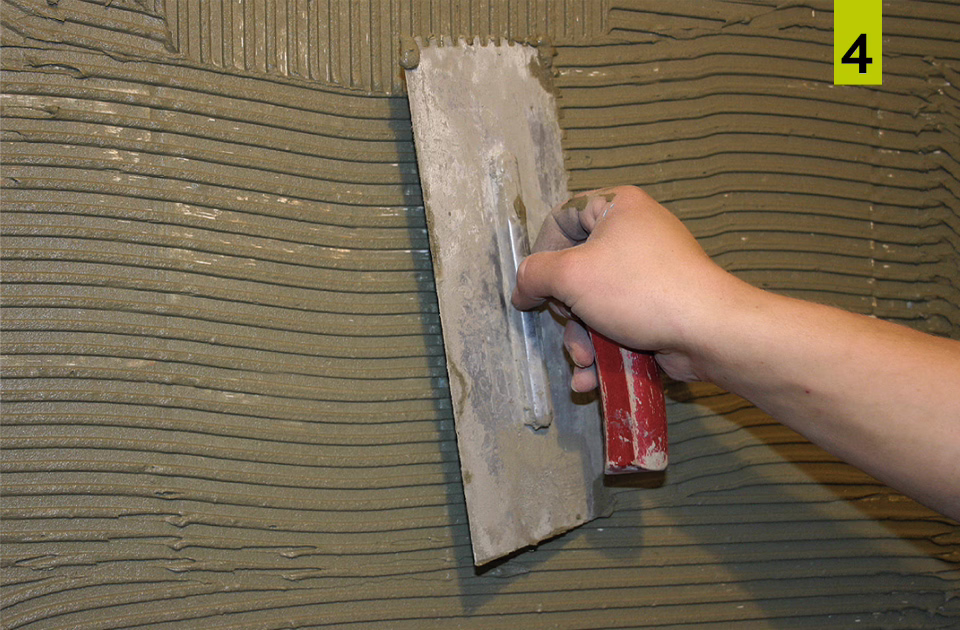 Apply the mixed mortar in sufficient thickness with a notched trowel.